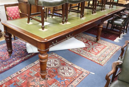 A Victorian style leather topped mahogany boardroom table, fitted four drawers on six fluted tapered legs L.426cm